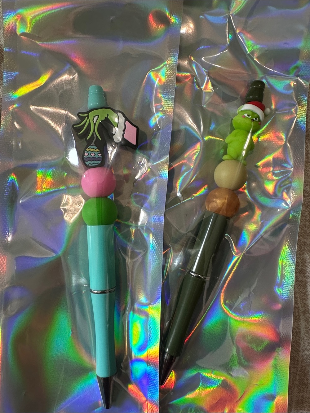 You’re a mean one Mr Grinch Topper Pens - Teal & Olive with Pink and Tan Accents